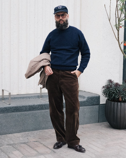 men standing wearing navy shetland sweater